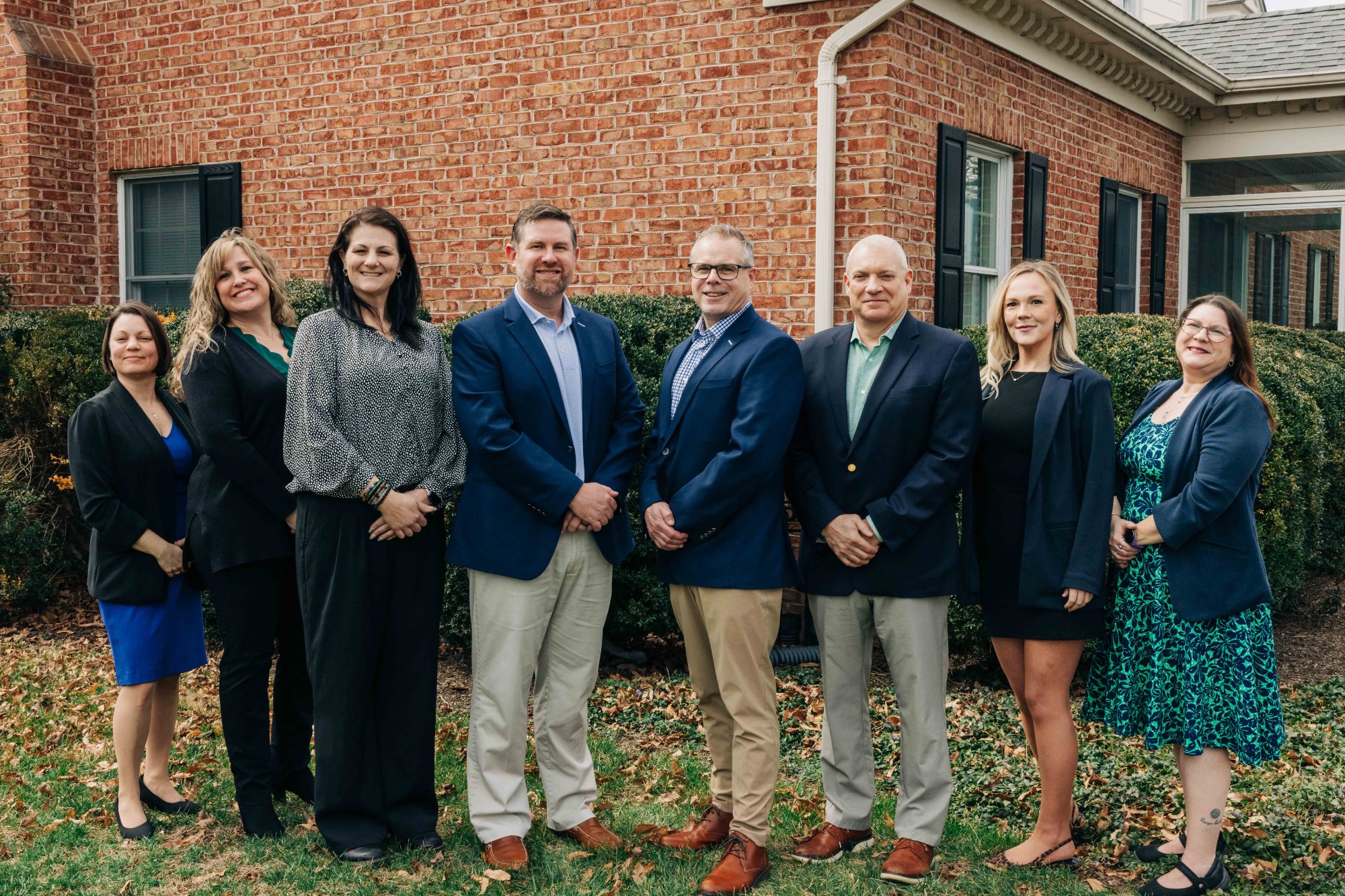 Water Street Financial full team of financial advisors standing outside their Winchester VA office