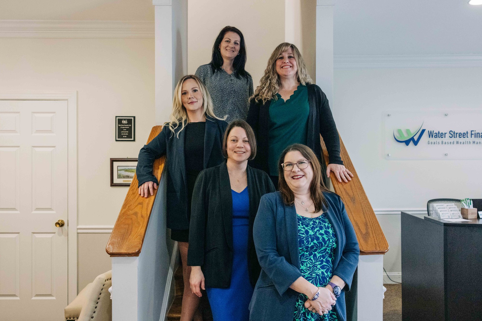 Water Street Financial women's advisory team on staircase at Winchester VA office